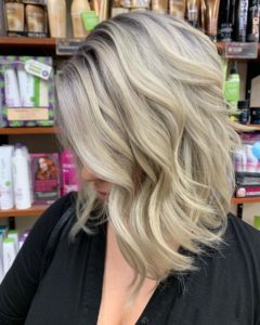 Woman with medium length hair and layers